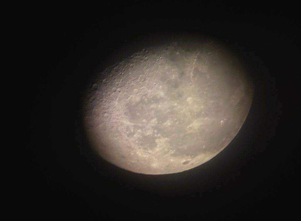 Photographing the moon as seen through an astronomical telescope